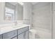 Modern bathroom features a vanity, a sink, a toilet and a shower over a tub with white subway tile surround at 336 E 1St Ave # 207, Denver, CO 80203