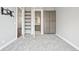 Bedroom featuring plush carpeting, built-in storage, and doorway views to an en suite bath at 336 E 1St Ave # 207, Denver, CO 80203