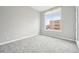 Neutral bedroom with a large window and plush carpeting; perfect for relaxation and rest at 336 E 1St Ave # 207, Denver, CO 80203