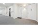 Apartment hallway featuring a stainless steel elevator and neutral carpeting at 336 E 1St Ave # 207, Denver, CO 80203