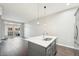 Stylish kitchen island with a sleek countertop and modern faucet, perfect for food preparation and casual dining at 336 E 1St Ave # 207, Denver, CO 80203