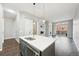 Stylish kitchen island with stainless steel dishwasher, sink, and pendant lighting at 336 E 1St Ave # 207, Denver, CO 80203