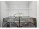 Modern laundry room with front-load washer and dryer set, offering convenience at 336 E 1St Ave # 207, Denver, CO 80203