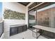 Inviting patio area featuring an outdoor storage box and table near sliding glass door at 336 E 1St Ave # 207, Denver, CO 80203