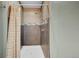 Tiled shower stall with updated shower head and hardware at 810 Miner St, Idaho Springs, CO 80452