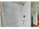Bathroom featuring tiled shower and tub combination at 810 Miner St, Idaho Springs, CO 80452