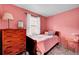 Bedroom featuring a window, dresser and dark trim at 810 Miner St, Idaho Springs, CO 80452