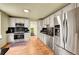 Well-lit kitchen featuring stainless steel appliances, granite countertops, and white cabinetry at 810 Miner St, Idaho Springs, CO 80452
