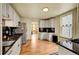 Cozy kitchen features stainless steel appliances, granite countertops, and white cabinetry at 810 Miner St, Idaho Springs, CO 80452