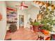 Bright living room featuring a bookcase, many houseplants and staircase at 810 Miner St, Idaho Springs, CO 80452