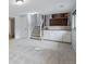 Basement area with carpet, a staircase, a wet bar and plenty of space at 12378 E Cedar Cir, Aurora, CO 80012