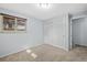 Bedroom featuring neutral walls, a window, and a closet, creating a serene and comfortable space at 12378 E Cedar Cir, Aurora, CO 80012