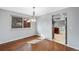 Dining room featuring hardwood floors, light blue walls, and ample natural light at 12378 E Cedar Cir, Aurora, CO 80012