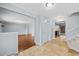 Inviting foyer featuring light blue walls, beige tile floors, closet, and staircase at 12378 E Cedar Cir, Aurora, CO 80012