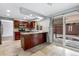 Open kitchen layout with granite counters, stainless steel appliances, and access to backyard at 12378 E Cedar Cir, Aurora, CO 80012