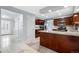 Modern kitchen features stainless steel appliances, a breakfast bar, and granite countertops at 12378 E Cedar Cir, Aurora, CO 80012