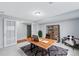 Bright home office featuring a modern wood desk, stylish decor, and light gray walls for a calming workspace at 12378 E Cedar Cir, Aurora, CO 80012