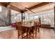 Large dining room with exposed wood beams, spiral stairs, and city views at 1745 Wazee St # 5E, Denver, CO 80202
