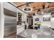 Modern kitchen featuring quartz countertops, an induction cooktop, and stainless steel refrigerator at 1745 Wazee St # 5E, Denver, CO 80202