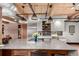 A view of this open kitchen with large island, wood ceiling, and modern fixtures at 1745 Wazee St # 5E, Denver, CO 80202