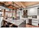 Modern kitchen with large waterfall island, stainless steel appliances, and unique lighting fixtures at 1745 Wazee St # 5E, Denver, CO 80202