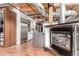Modern kitchen with marble island, stainless steel appliances, and adjacent fireplace at 1745 Wazee St # 5E, Denver, CO 80202