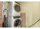 Efficient laundry area with stacked washer and dryer for convenient in-home laundry at 1745 Wazee St # 5E, Denver, CO 80202