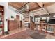Open-concept living room with hardwood floors, a wooden desk area, and a view into the bedroom at 1745 Wazee St # 5E, Denver, CO 80202
