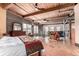 Bright main bedroom features an open loft area, exposed ceilings and ductwork at 1745 Wazee St # 5E, Denver, CO 80202