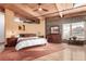 Spacious main bedroom featuring exposed brick, wood ceiling, large window and plenty of natural light at 1745 Wazee St # 5E, Denver, CO 80202