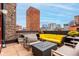 Modern rooftop terrace with comfortable seating and city views at 1745 Wazee St # 5E, Denver, CO 80202