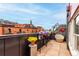 Charming rooftop terrace with potted flowers and comfortable seating area overlooking the cityscape at 1745 Wazee St # 5E, Denver, CO 80202