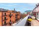 Rooftop terrace featuring city views, stylish furniture and beautiful potted flowers at 1745 Wazee St # 5E, Denver, CO 80202
