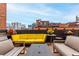 Enjoy urban living on this rooftop patio with comfortable seating and a grill with city views at 1745 Wazee St # 5E, Denver, CO 80202