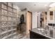 Spa-like shower featuring glass block, stone tile, modern shower head and storage at 1745 Wazee St # 5E, Denver, CO 80202
