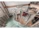 A winding, glass, and metal staircase connecting floors to the rest of this loft at 1745 Wazee St # 5E, Denver, CO 80202