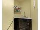 Practical utility sink with storage cabinet, perfect for cleaning and household tasks at 1745 Wazee St # 5E, Denver, CO 80202