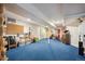 Spacious finished basement with blue carpeting and ample storage, great for recreation or hobbies at 12705 Home Farm Dr, Westminster, CO 80234