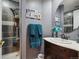 Cozy bathroom featuring a walk-in shower, sleek vanity, and decorative details for a spa-like feel at 12705 Home Farm Dr, Westminster, CO 80234