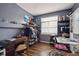 Functional bedroom featuring a desk, closet space, and ample natural light, creating a comfortable and practical living area at 12705 Home Farm Dr, Westminster, CO 80234