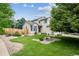 Attractive home featuring a lush green lawn, mature trees, and a charming, well-maintained facade at 12705 Home Farm Dr, Westminster, CO 80234