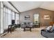 This living room is bright and spacious with its vaulted ceilings, large windows, and comfortable seating at 12705 Home Farm Dr, Westminster, CO 80234