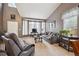 This living room is bright and spacious with its vaulted ceilings, large windows, and comfortable seating at 12705 Home Farm Dr, Westminster, CO 80234