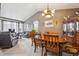 Spacious living and dining area with vaulted ceilings, large windows, and stylish decor, perfect for entertaining or relaxing at 12705 Home Farm Dr, Westminster, CO 80234