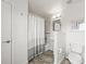 Bathroom featuring neutral paint, white fixtures, and a shower/bath with modern tile at 6566 S Telluride St, Aurora, CO 80016
