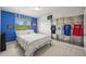 Bedroom featuring wall decor and accents, a bed with white bedding, and a window for natural light at 6566 S Telluride St, Aurora, CO 80016