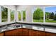 Kitchen sink with stainless steel appliances, granite countertops, and ample natural light at 6566 S Telluride St, Aurora, CO 80016