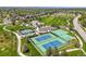 Aerial view showcasing the community park featuring tennis courts, playgrounds, and open green spaces at 6566 S Telluride St, Aurora, CO 80016
