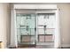 Balcony access provided through sliding glass doors; features white curtains for privacy at 2650 Front View # 205, Denver, CO 80211