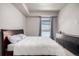 Bedroom featuring a bed, carpeted floor, and a large window at 2650 Front View # 205, Denver, CO 80211